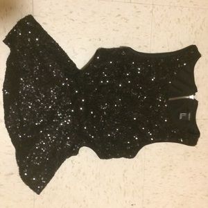 Black sequin peplum shirt with cut out sides.